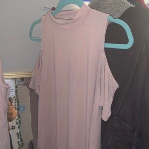 Mock neck shoulder showing light pink blouse